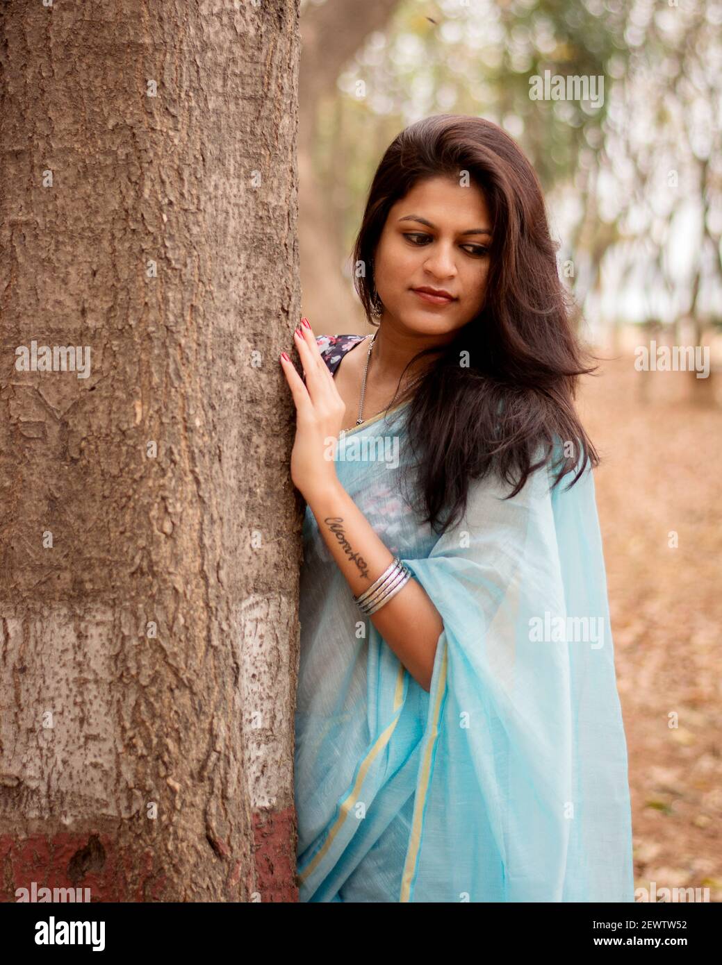 Nothing makes an Indian girl look as beautiful as a saree does. Stock Photo