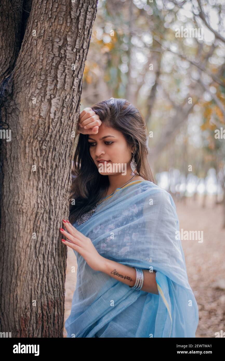 Image of Indian traditional Beautiful Woman Wearing an traditional Saree  And Posing On The Outdoor With a Smile Face-NE253758-Picxy