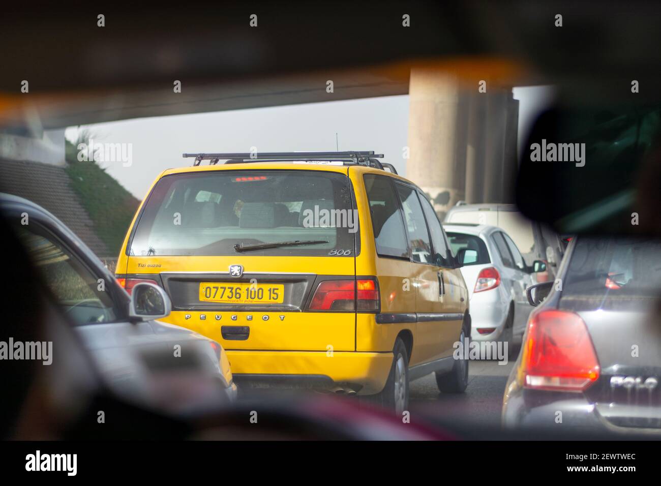 A yellow taxi van in the traffic Stock Photo - Alamy