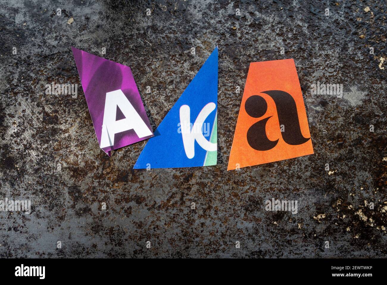 The acronym AKA is short for 'also known as' and is spelled out in ransom note style topography, USA Stock Photo