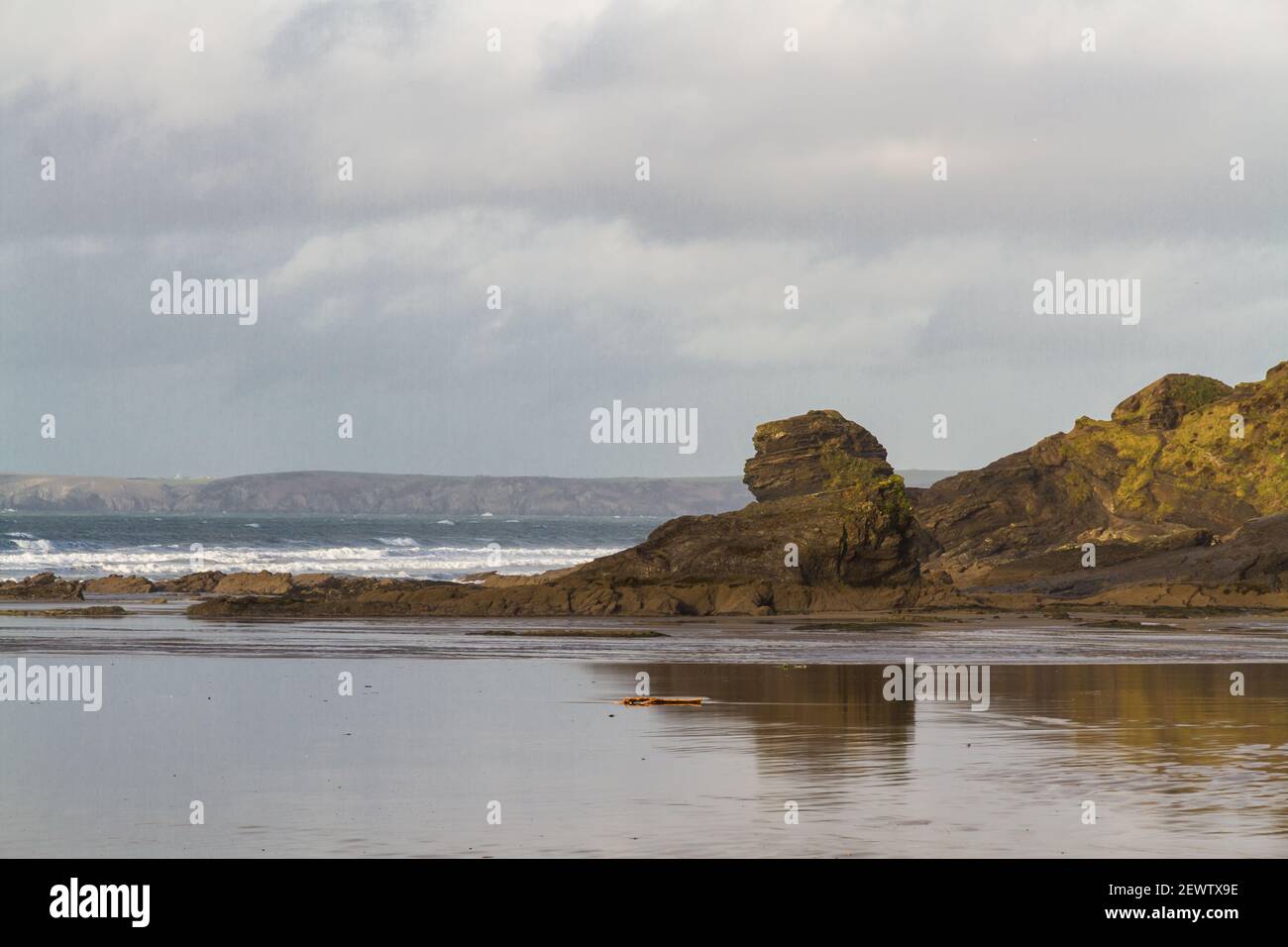 View of Lion’s Head Rock at Broad Haven Beach on stormy day, landscape