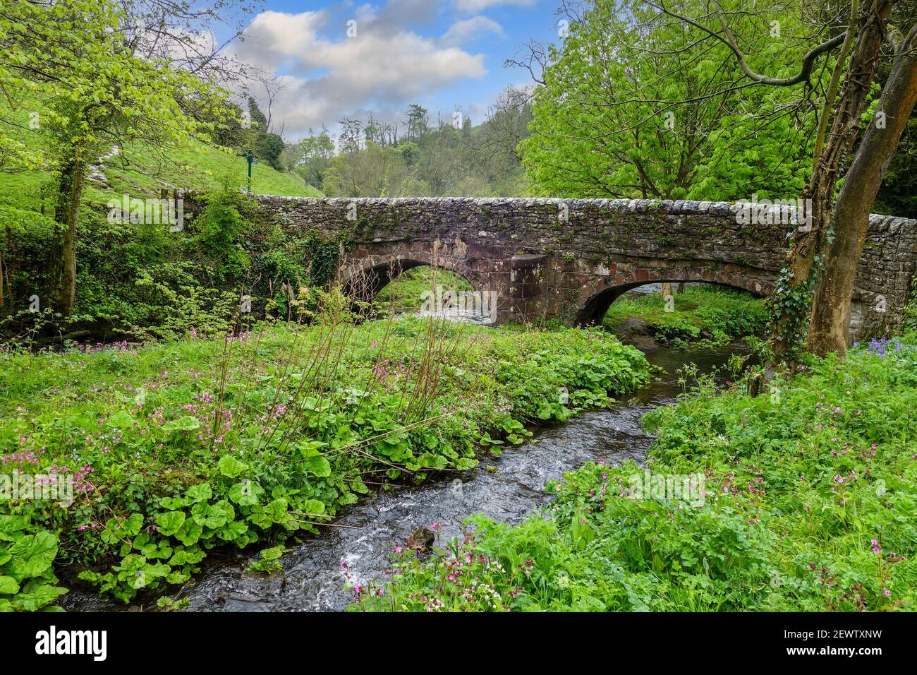Viators Bridge, a medieval packhorse bridge over the River Dove, Milldale, Derbyshire, England