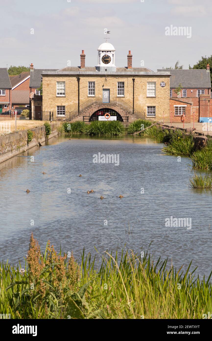 Weedon, Northamptonshire, UK - July 10th 2018: The East Lodge, at the entrance to a former army Ordnance Depot, stands at the end of a waterway. Stock Photo