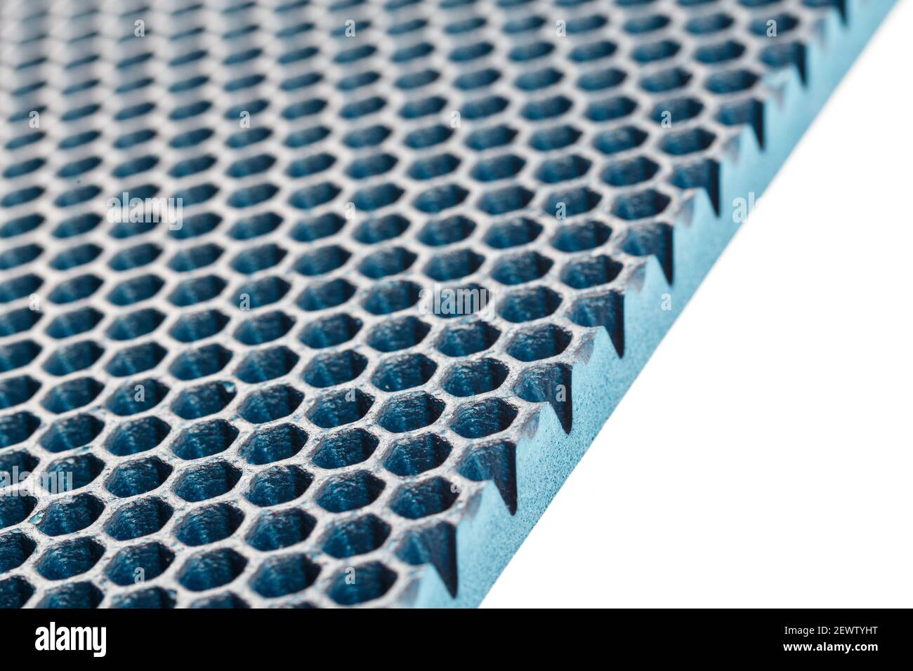 rulle Rend pad blue hexagonal punched EVA - ethylene vinyl acetate foam carpet linear  perspective background with selective focus Stock Photo - Alamy