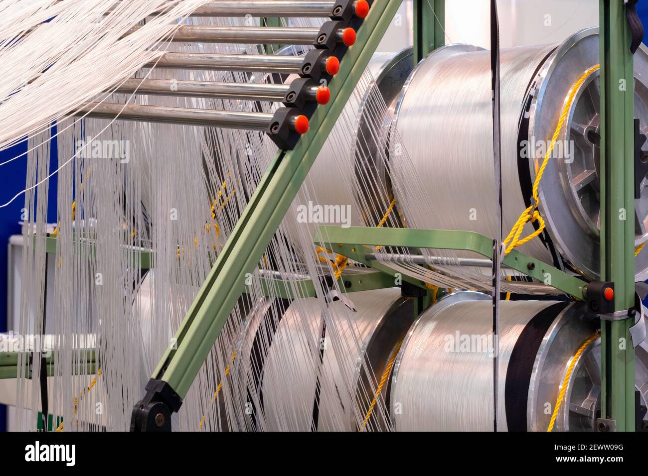 Reels of textile yarn thread at industrial weaving manufacturing ...