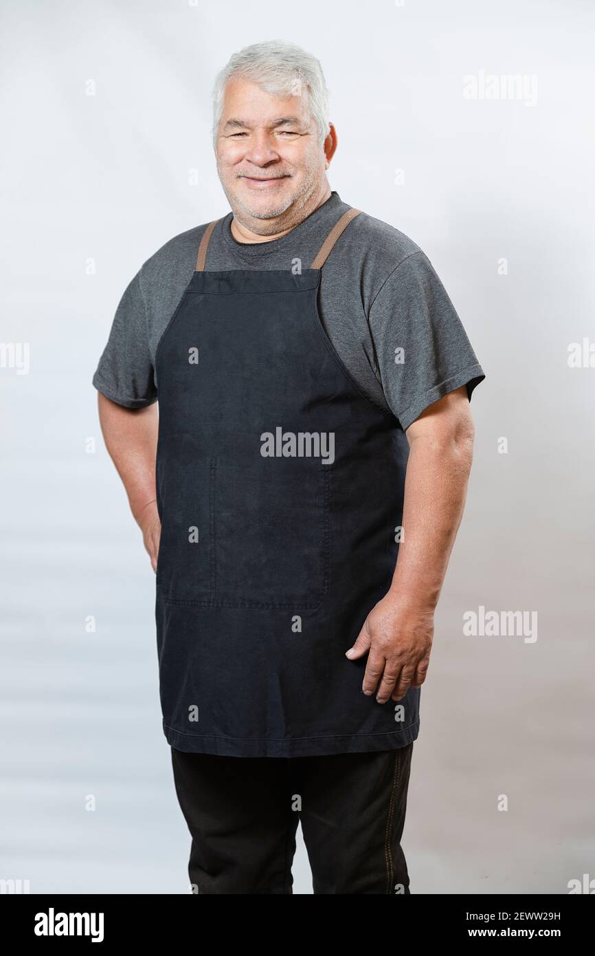 Mockup of man with apron - Elderly man with apron - Senior worker with  uniforms Stock Photo - Alamy