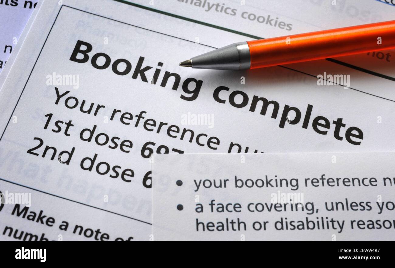 NHS CORONAVIRUS VACCINE BOOKING APPOINTMENT CONFIRMATION LETTER WITH PEN RE COVID-19 VACCINATION VACCINATE INJECTION  PANDEMIC JAB ETC UK Stock Photo