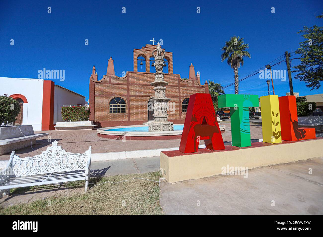 Fountain, monumental colored letters and Temple of San Francisco de Asís in Atil, Sonora Mexico. Atil small town in the northwest of the Mexican state of Sonora. The neighboring municipalities are Tubutama, Trincheras, Oquitoa and Altar. It was founded in 1751 Jesuit missionary Jacobo Sedelmayer. The first inhabitants were the Pima Alto or Nebome Indians. Atil means 'Arrowhead', in the Pima language.  (Photo by Luis Gutierrez / Norte Photo)  Fuente, letras monumentales de colores y Templo de San Francisco de Asís en Atil, Sonora Mexico. Átil pequeño pueblo en el noroeste del estado mexicano de Stock Photo