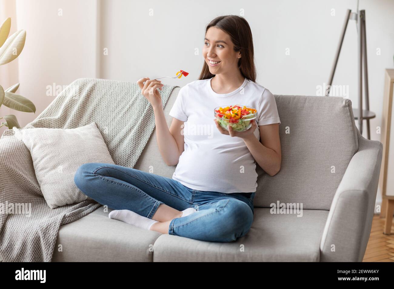 Healthy Diet During Pregnancy. Young expectant woman enjoying fresh