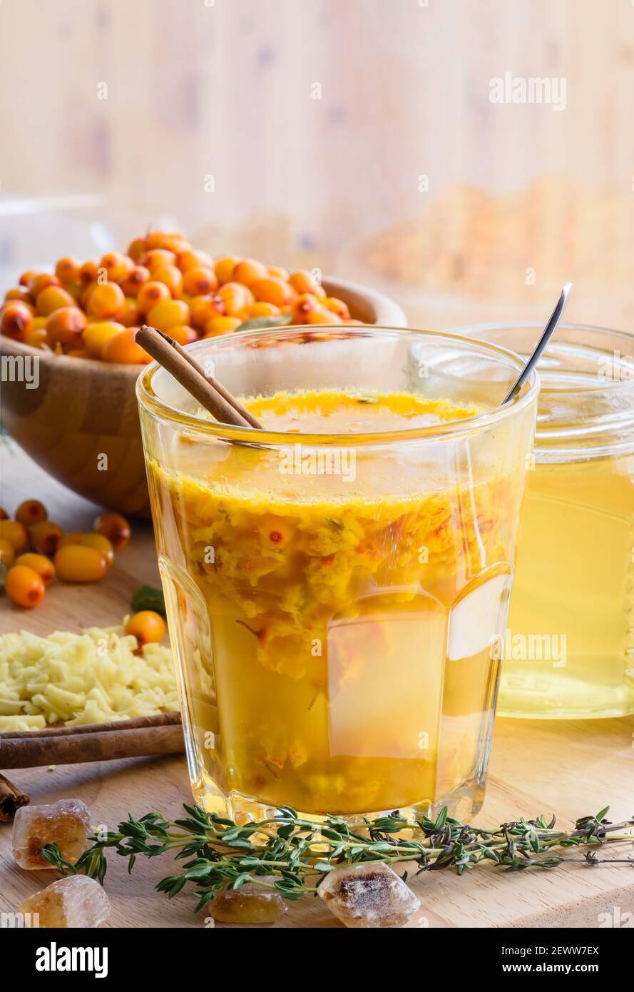 sea buckthorn honey ginger mix in glass with ingredients. Helpful