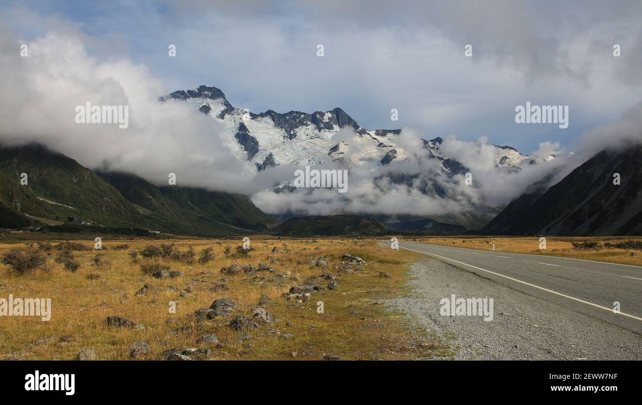 Road towards Mount Cook village. Mount Sefton and The Footstool. Stock Photo
