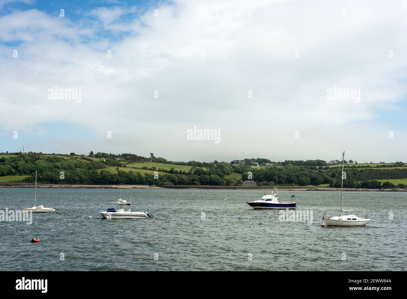 Moored boats and yachts in the River Blackwater on the Youghal Bay and harbour in Youghal, County Cork, Ireland Stock Photo
