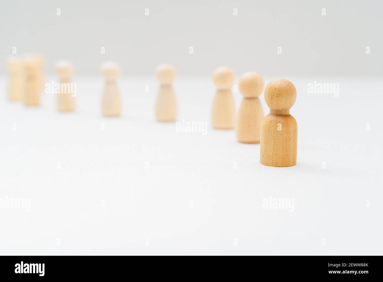Follow The Leader. Wooden Peg Dolls Leader and Followers. Leadership Concept. Stock Photo