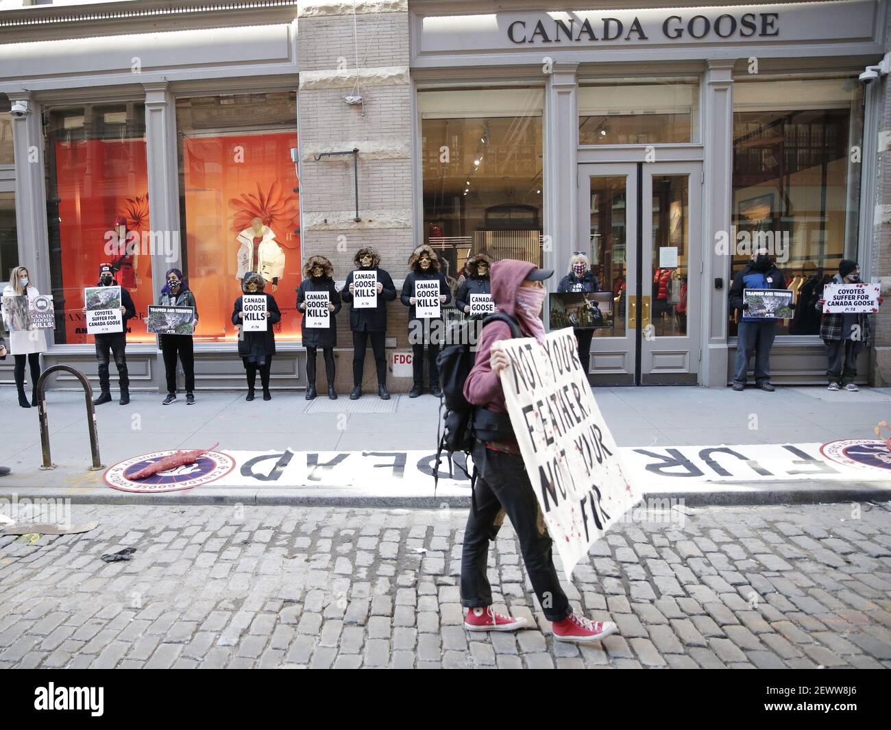 New York, United States. 03rd Mar, 2021. PETA protesters wearing skull  masks and fake Canada Goose coats holds signs at a protest outside of a Canada  Goose retail store in New York