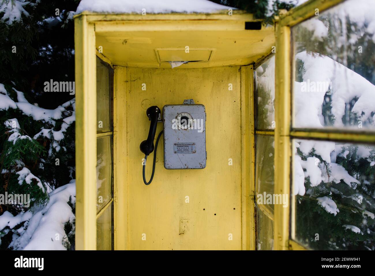 Vintage callbox, yellow telephone booth, retro payphone Stock Photo