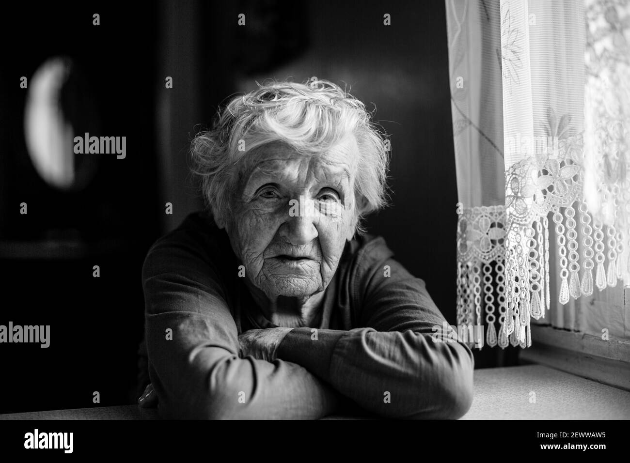 Old woman head in hands Black and White Stock Photos & Images - Alamy