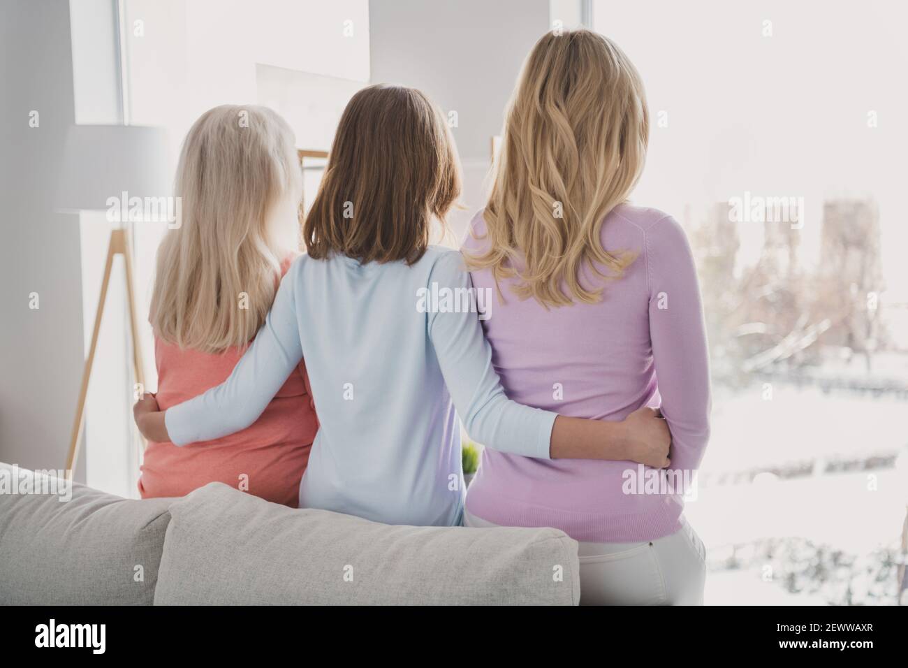 Rare view photo of granddaughter hugging granny mother in casual clothes spending time together at home Stock Photo