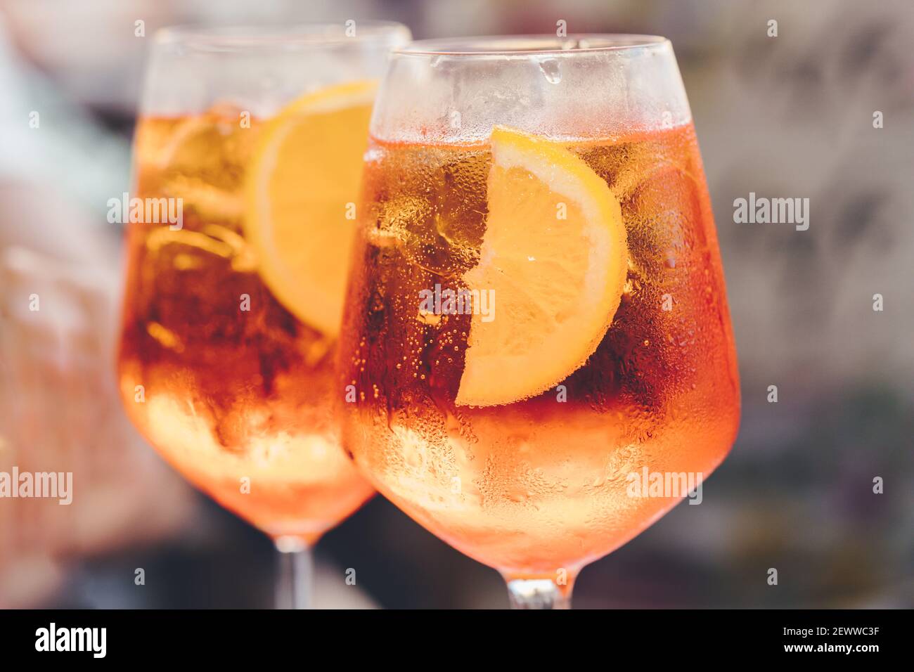 Glass of ice cold Aperol spritz cocktail served in a wine glass
