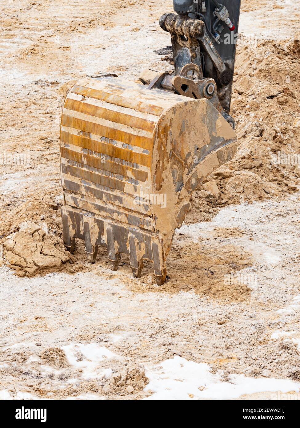 Detail of an excavator bucket. Backhoe bucket digging the soil. Crawler