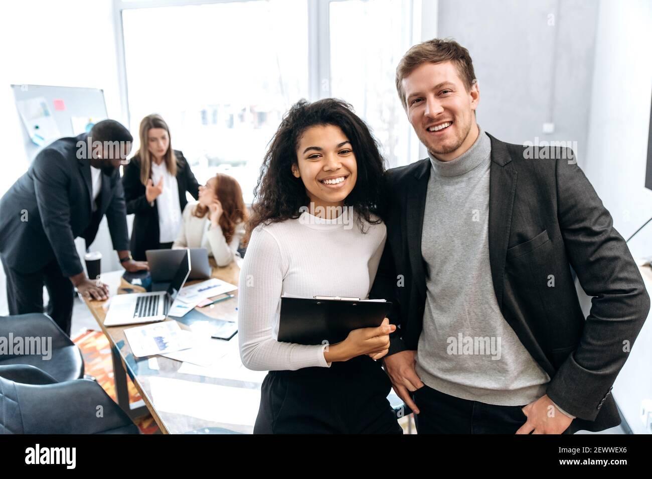 Portrait of two multiracial successful colleagues, African American ...