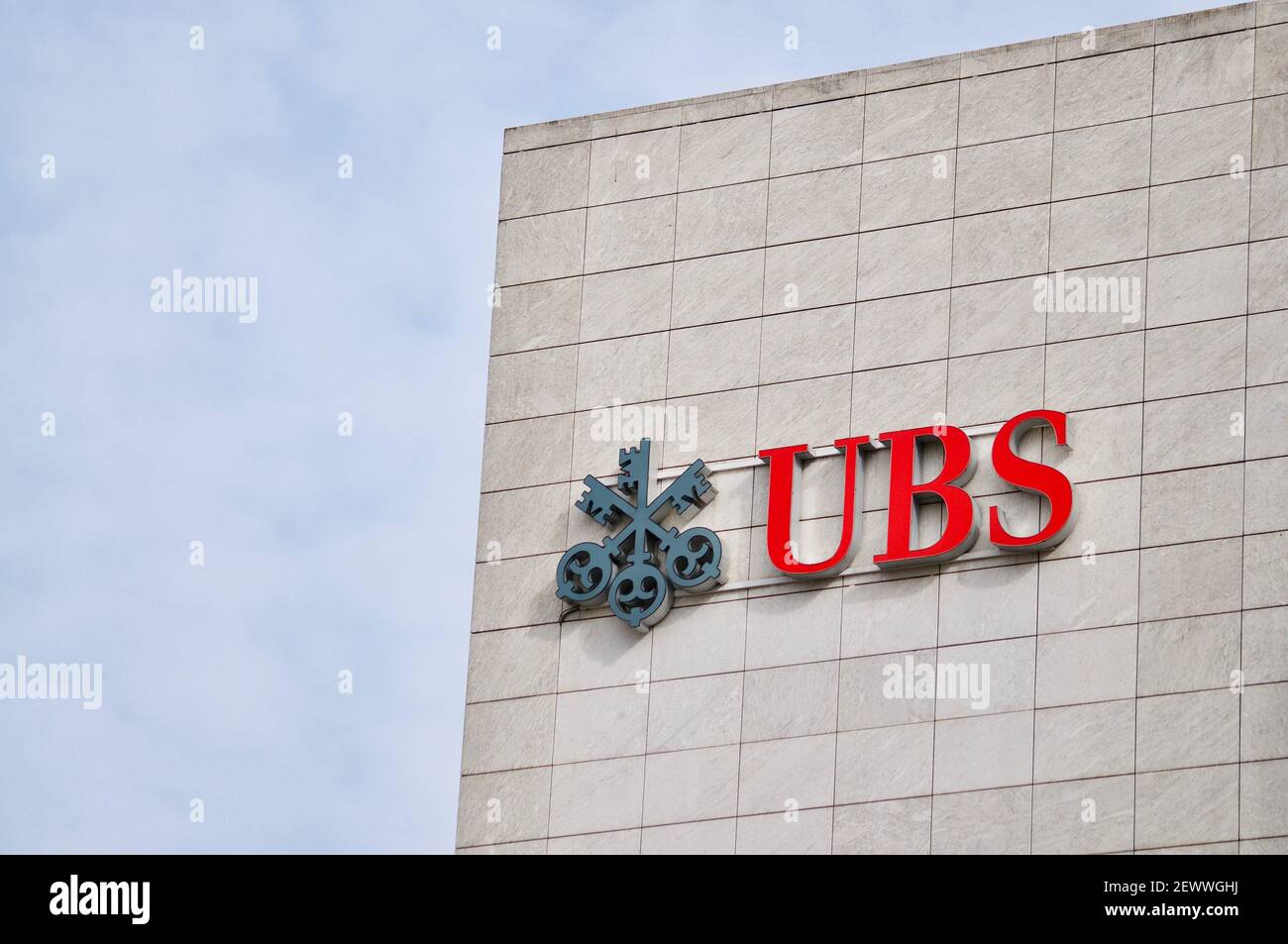 Zug, Switzerland - 26th February 2021 : UBS Bank logo sign hanging on a building facade in Zug. UBS is one of the leading banks in Switzerland and in Stock Photo