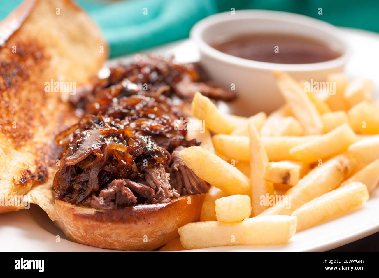 classic french dip au jus or beef dip with fries and sauteed onions