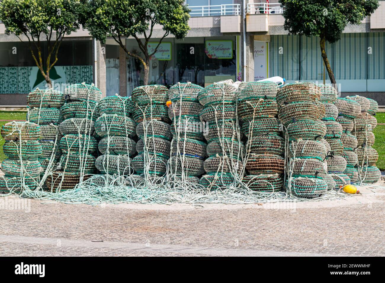 Octopus and crab traps used by locals fishermans in Apúlia, Portugal waiting to the next fish trip. Fishermans on land waiting to go fishing. Stock Photo