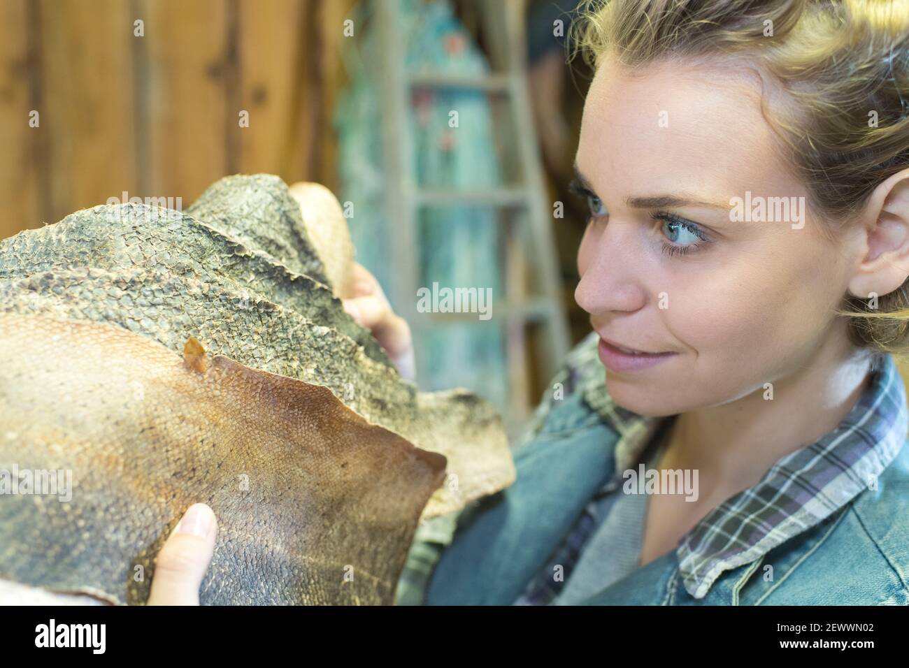 female artisan inspecting dried fish skins Stock Photo Alamy