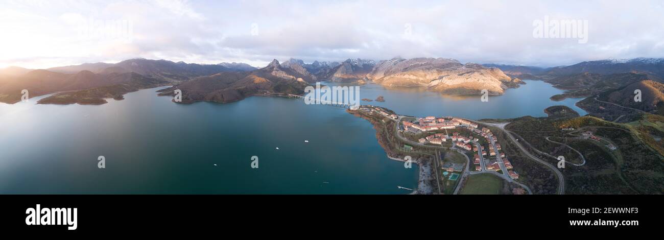 sunrise in high mountain reservoir from aerial view in panoramic Stock Photo
