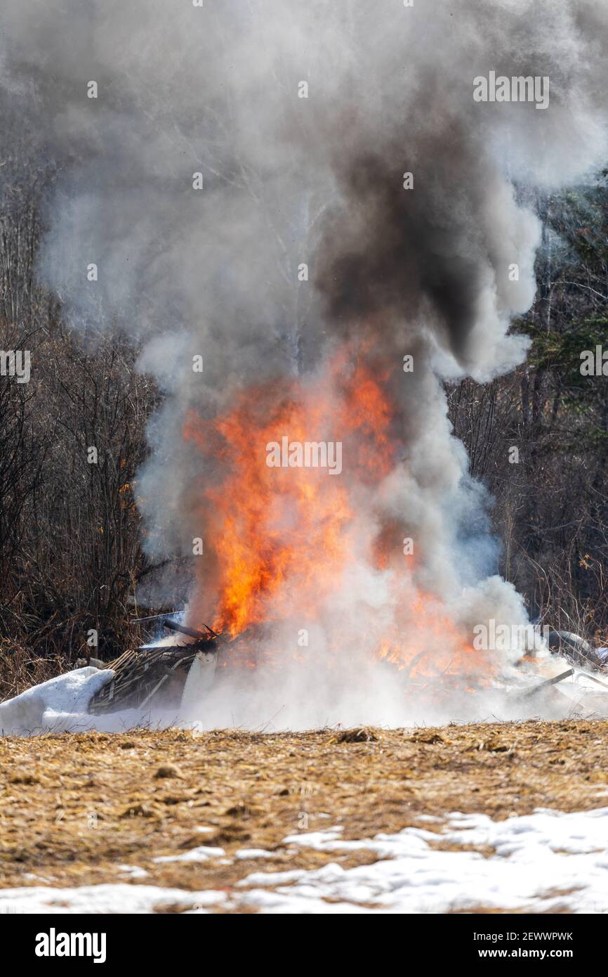Northern Wisconsin homeowner burning their trash. Stock Photo