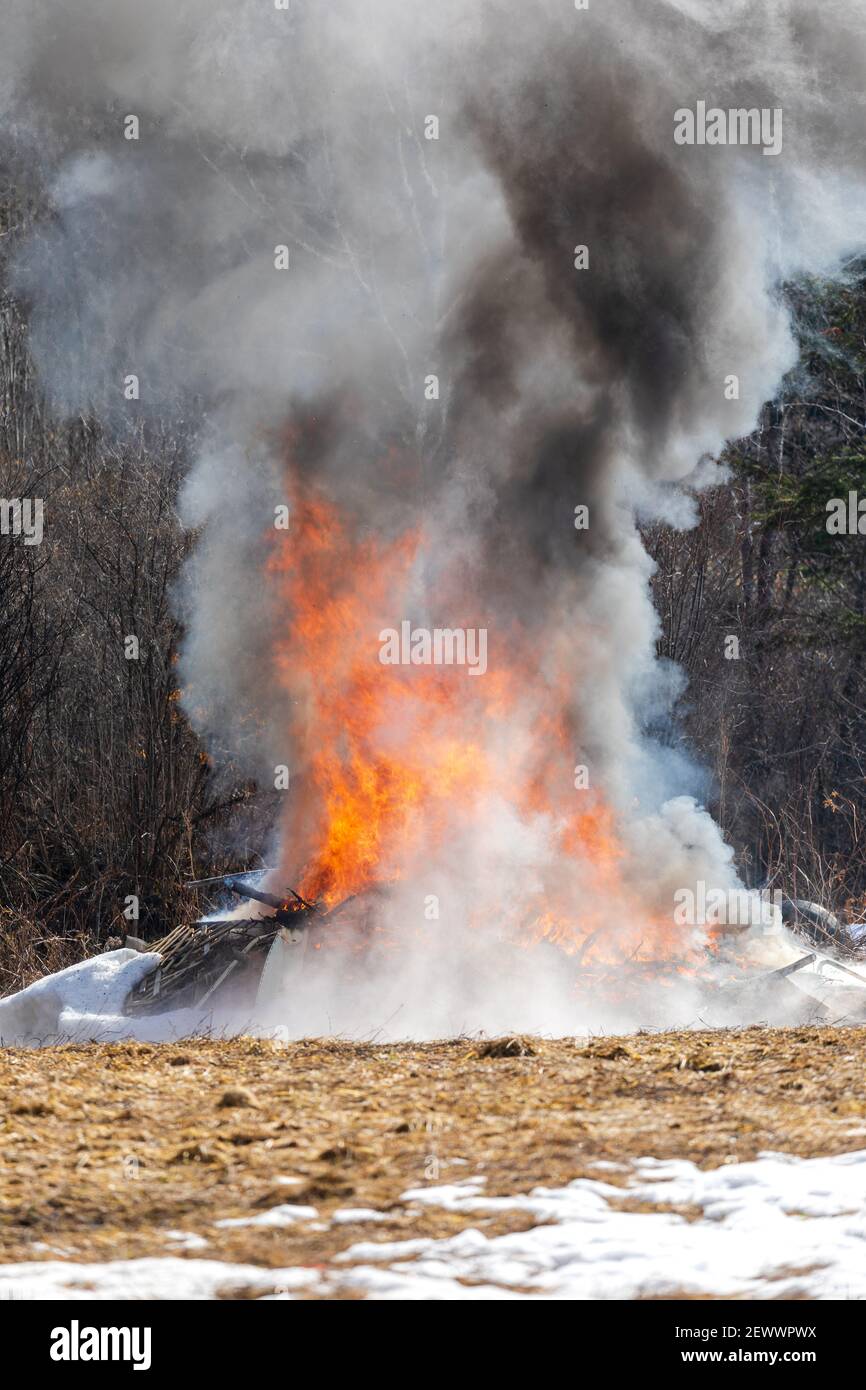 Northern Wisconsin homeowner burning their trash. Stock Photo
