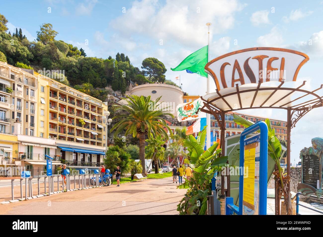 View of Castle Hill from the Promenade in front of Castel Plage and restaurant in Old View Nice France on the French Riviera. Stock Photo