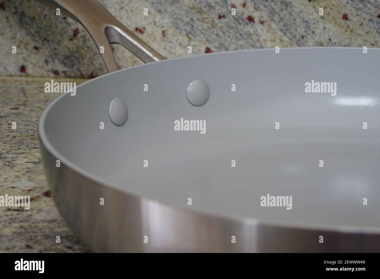 A brand new ceramic frying pan with grey non-stick coating Stock Photo