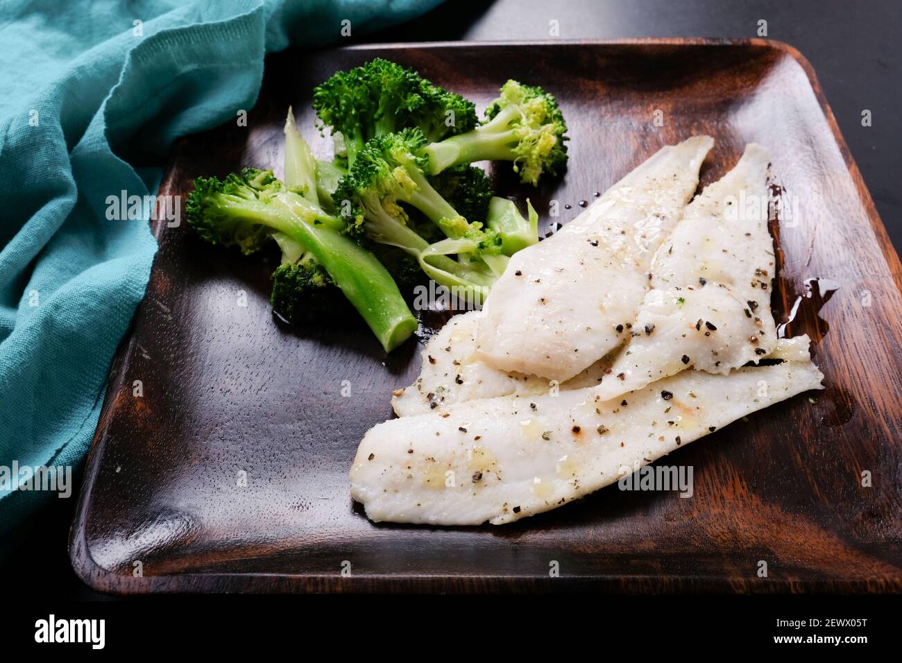 tilapia fillet with lemon and vegetables, a ketogenic diet meal Stock
