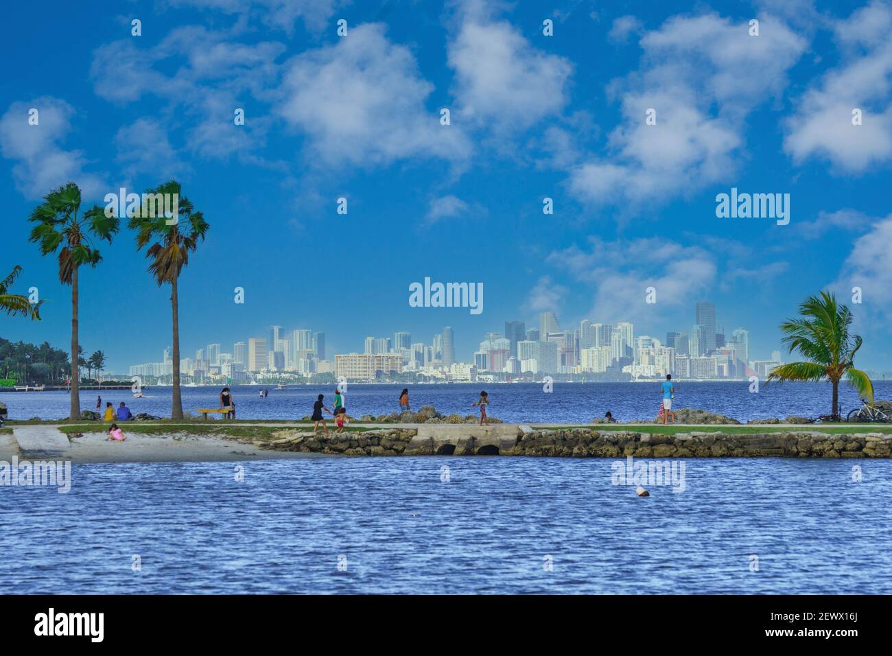Beach goers on the walkway of the atoll pool at Matheson Hammock Park