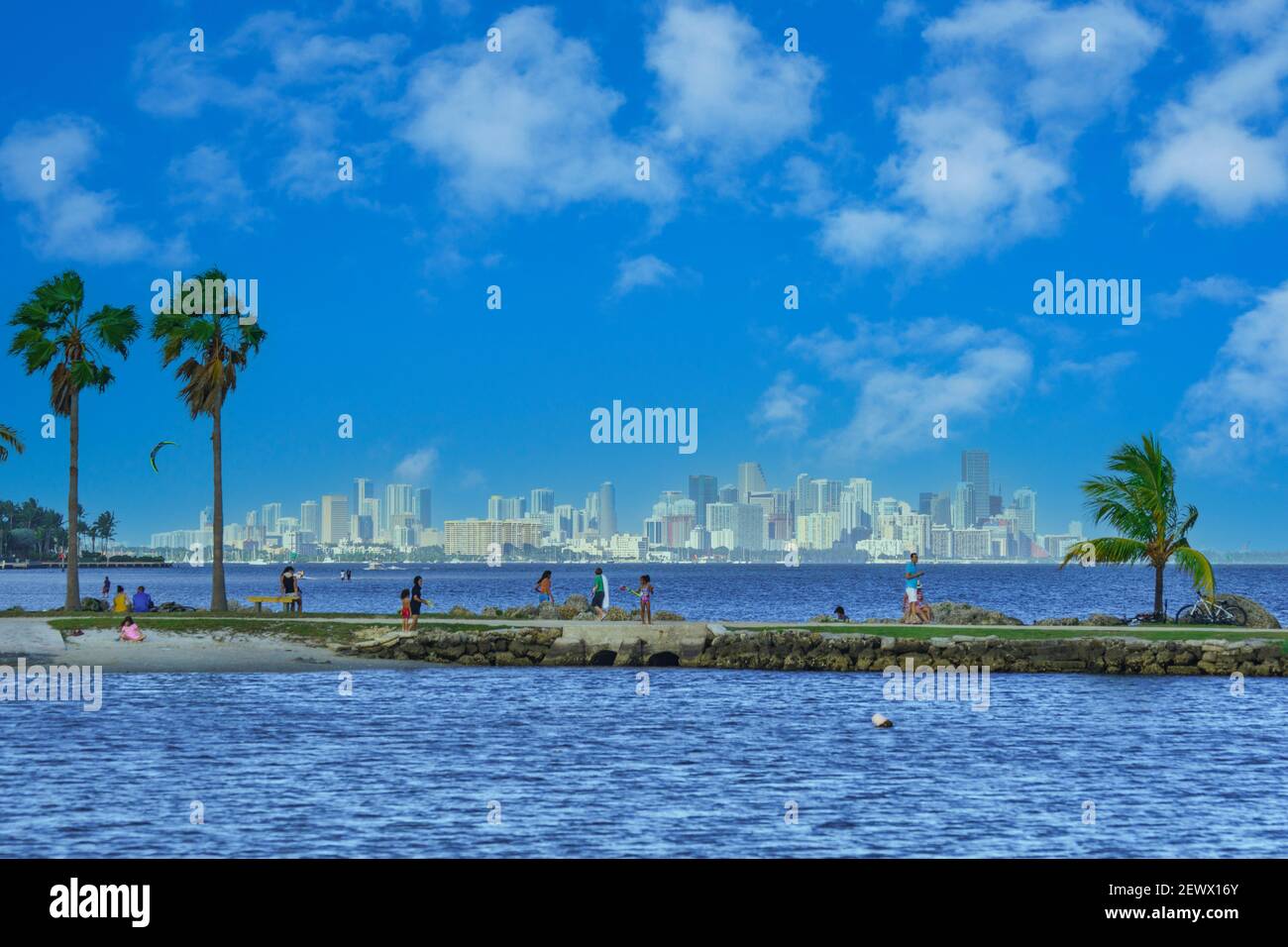 Beach goers on the walkway of the atoll pool at Matheson Hammock Park
