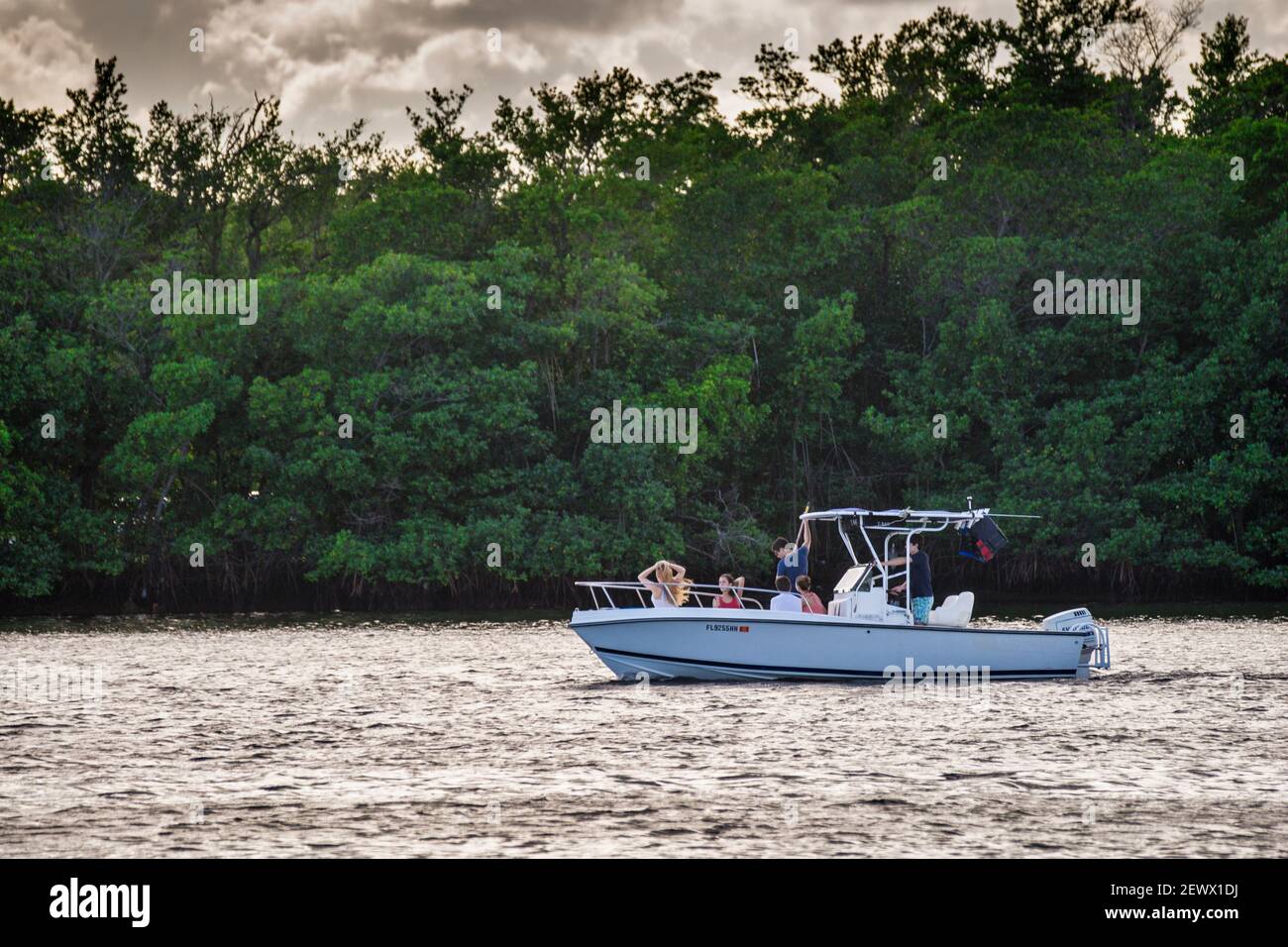 A boat leaving Matheson Hammock Park in the late afternoon in Miami