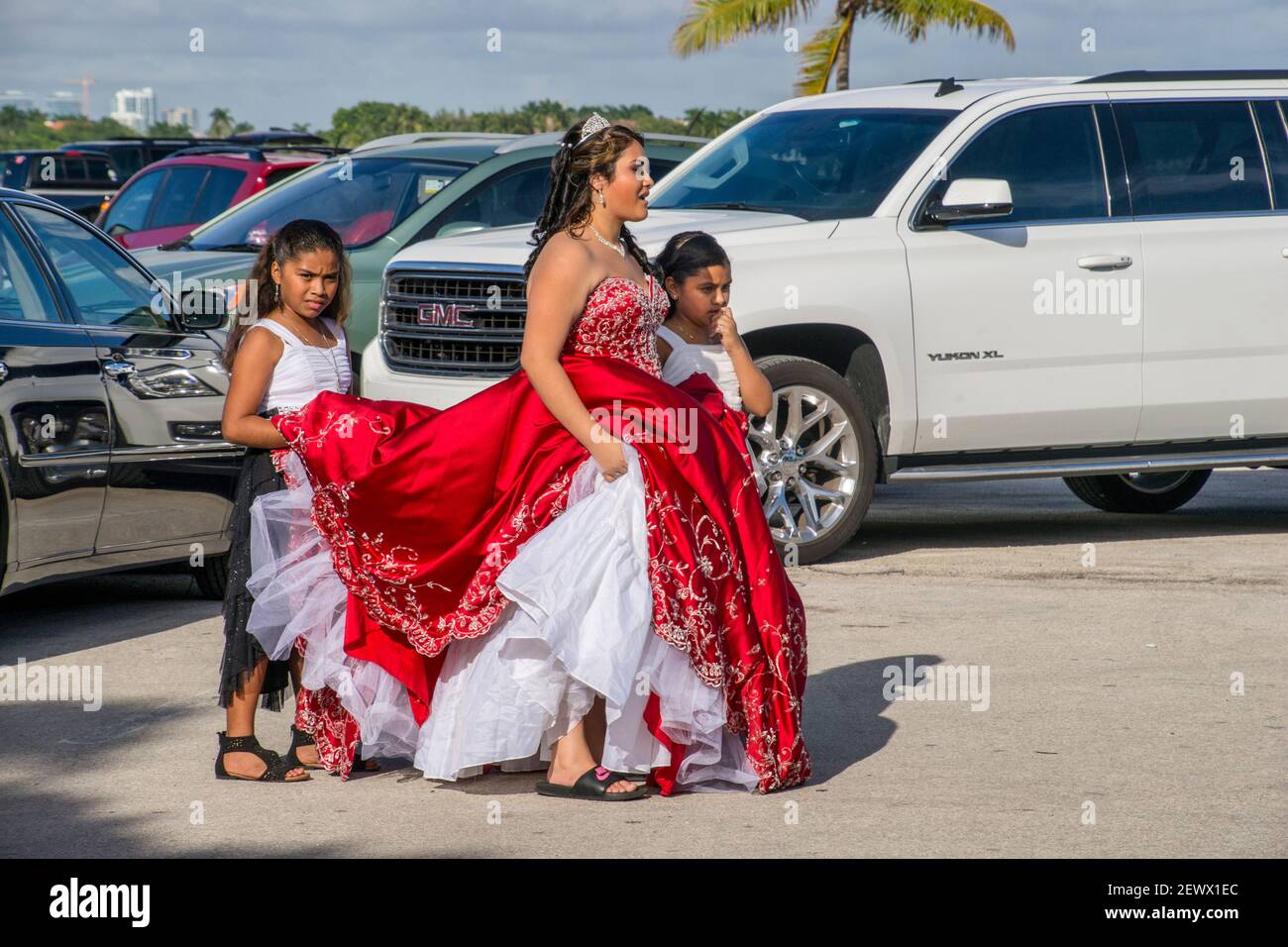 A quinceañera with her sisters goes to pose for her 15th Birthday photos at Matheson Hammock