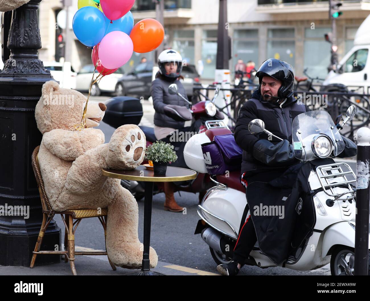 Paris Giant teddy bears are seen at a restaurant which offers take away services in Paris. Restaurants. 30th Oct 2020. A man riding a motorbike looks at a giant teddy bear outside