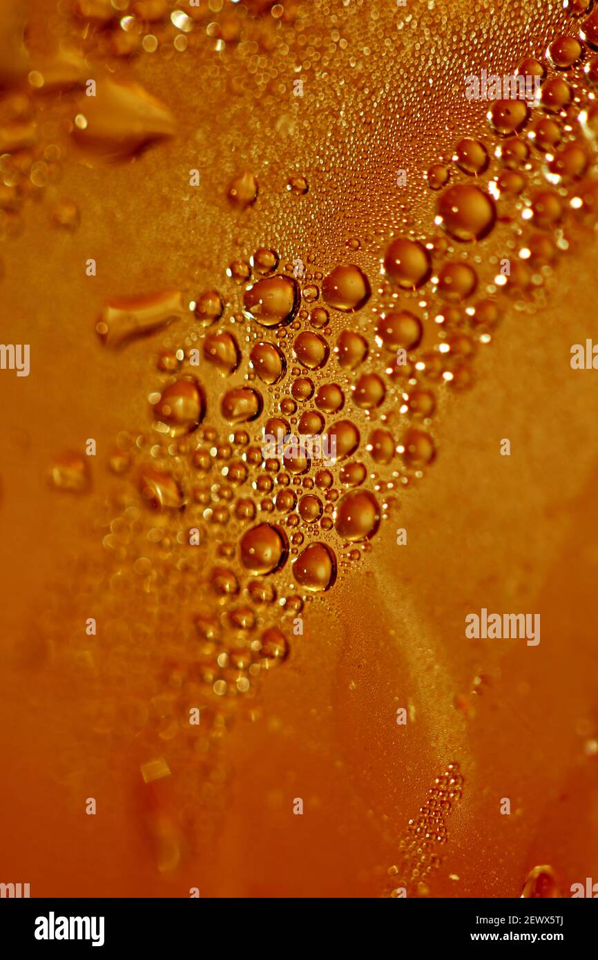 Macro shooting of water droplets beside the glass surface close up liquid drops modern background pattern high quality prints Stock Photo