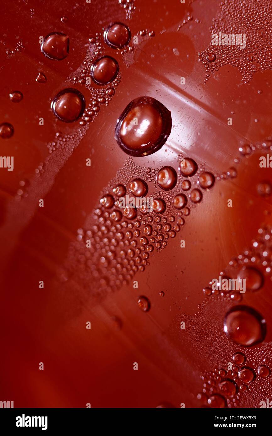 Macro shooting of water droplets beside the glass surface close up liquid drops modern background pattern high quality prints Stock Photo