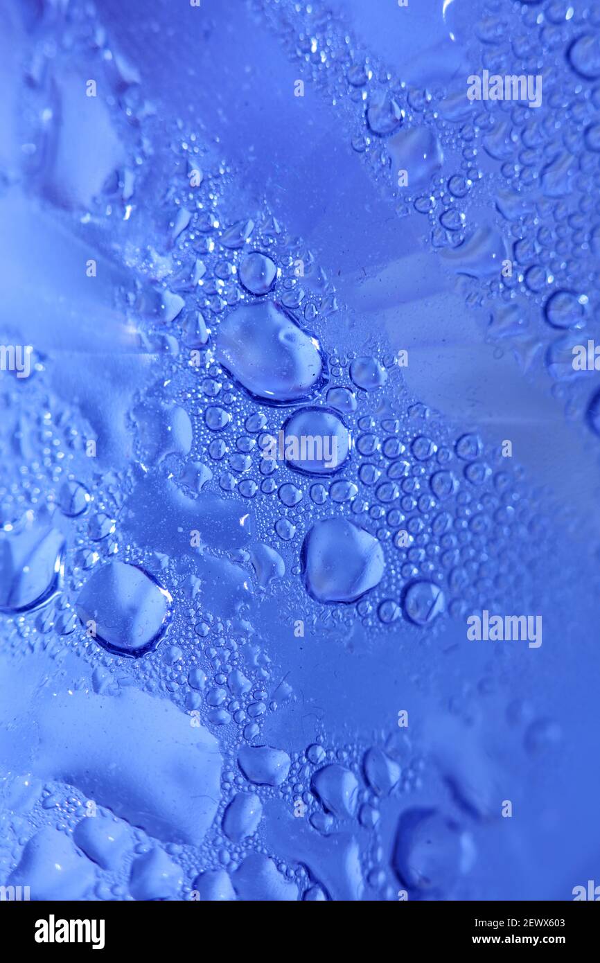 Macro shooting of water droplets beside the glass surface close up liquid drops modern background pattern high quality prints Stock Photo