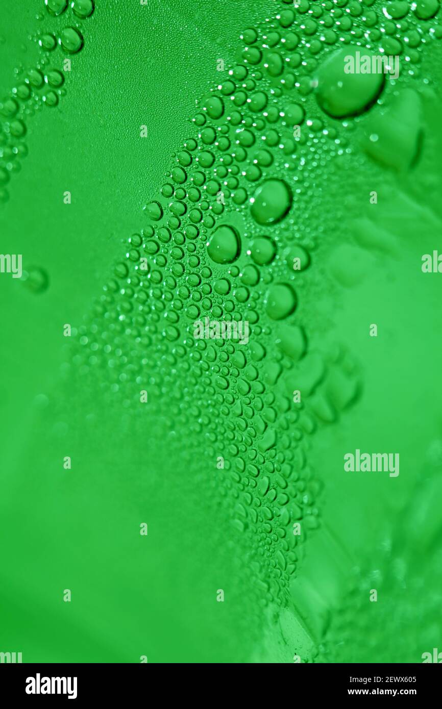 Macro shooting of water droplets beside the glass surface close up liquid drops modern background pattern high quality prints Stock Photo