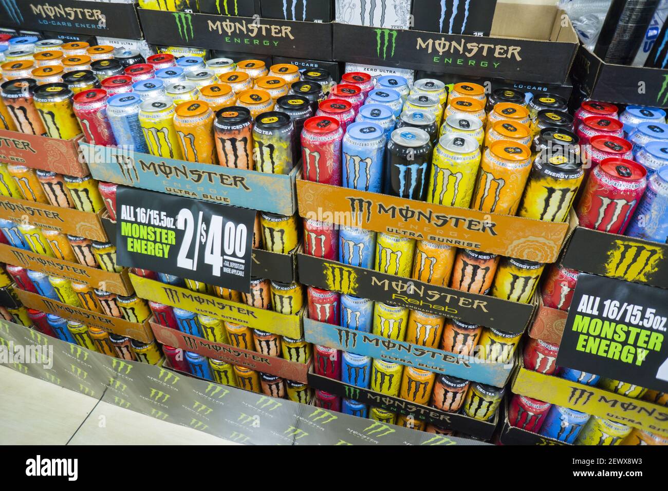 A display of Monster brand energy drinks on sale in a convenience store ...