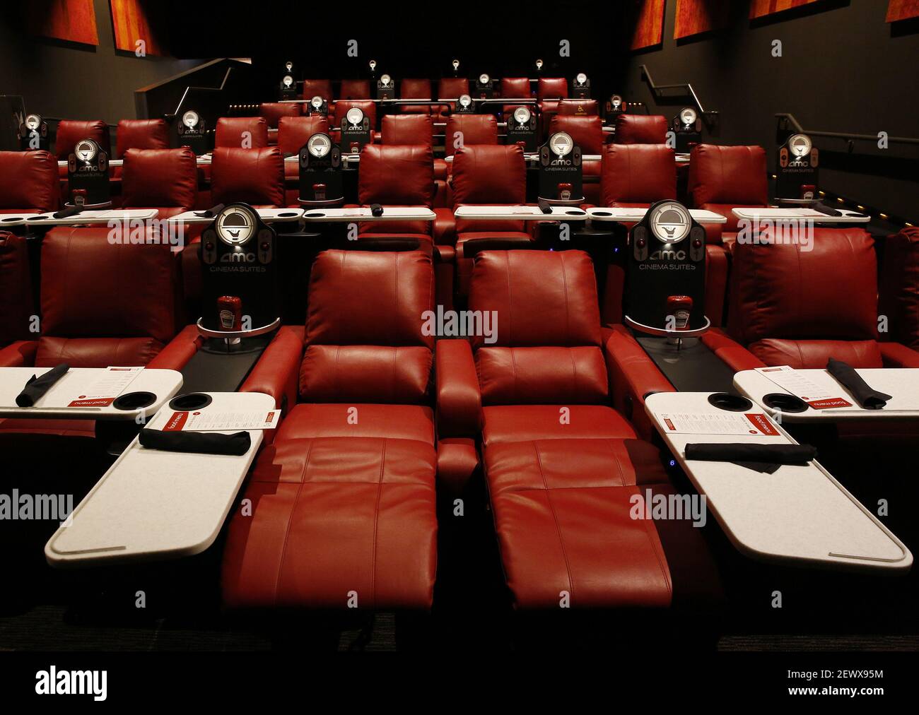Reclining theater seats with pivoting dining trays are among the amenities  in AMC's Dine-In Theatre at Block 37 in downtown Chicago, Ill. AMC says  theaters with recliners have seen a 40 to