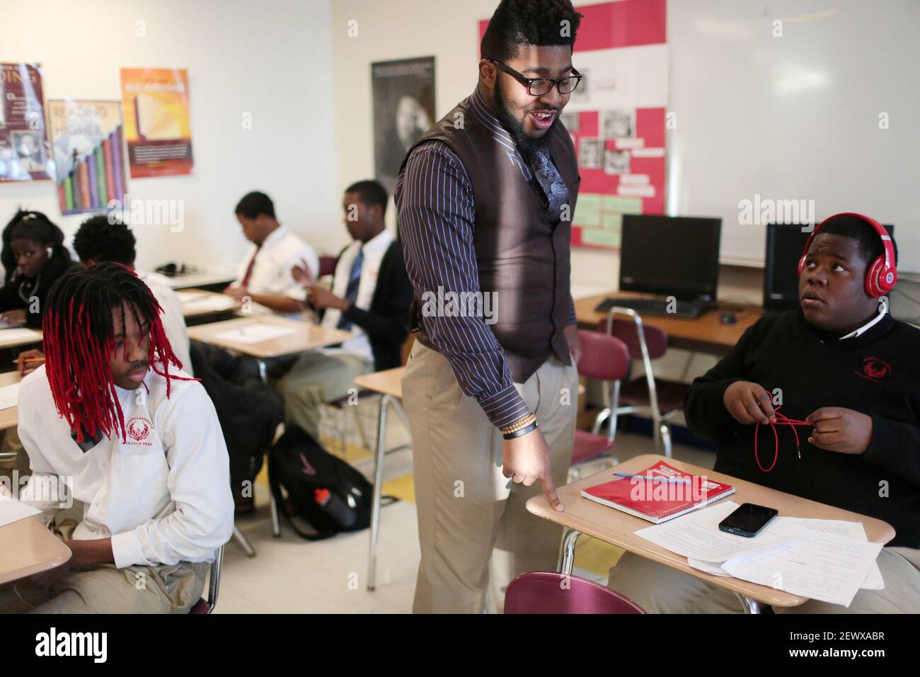 Jeramey Winfield helps students with an ACT practice exercise while