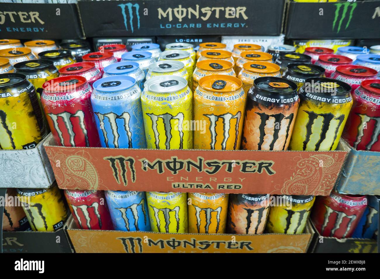 A display of Monster brand energy drinks on sale in a convenience store