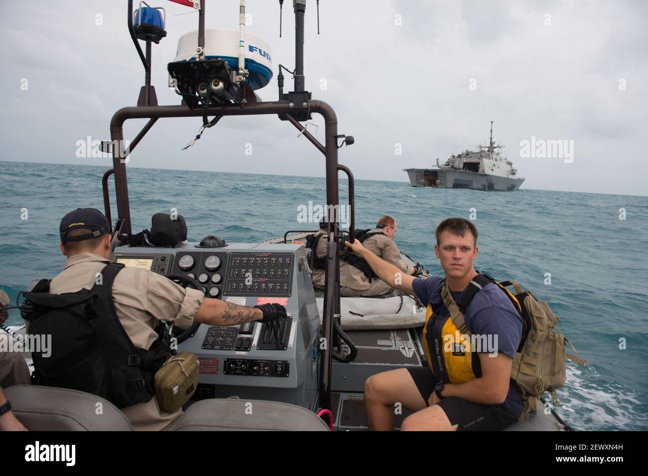 JAVA SEA (Jan. 4, 2015) Sailors aboard the littoral combat ship USS ...