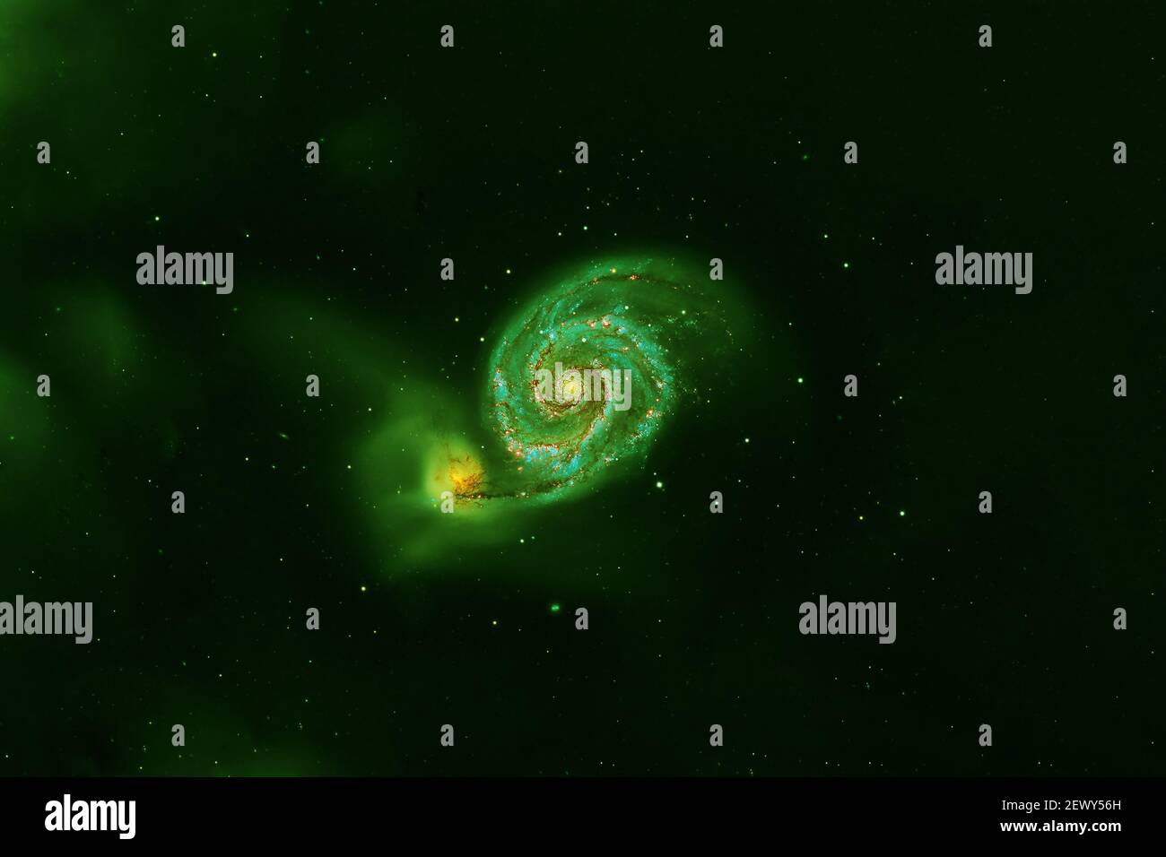 Green spiral galaxy on a dark background. Elements of this image were furnished by NASA. Stock Photo