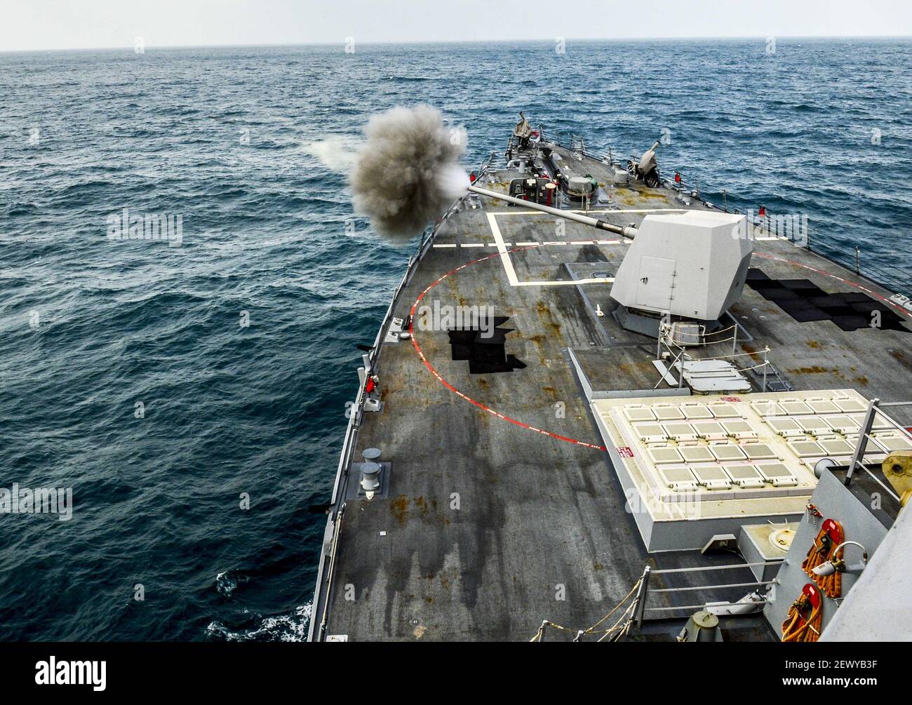 ARABIAN GULF (Jan. 11, 2015) The guided-missile destroyer USS Sterett (DDG 104) conducts a live-fire exercise with its MK 45 5-inch 54/62 caliber gun. Sterett is deployed as part of the Carl Vinson Carrier Strike Group supporting maritime security operations, strike operations in Iraq and Syria as directed and theater security cooperation efforts in the U.S. 5th Fleet area of responsibility. (Photo by Mass Communication Specialist 3rd Class Eric Coffer/U.S. Navy) *** Please Use Credit from Credit Field *** Stock Photo